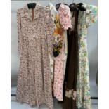1970’s maxi dresses: a cream long-sleeved dress with buttons to the cuff, the floral pattern in