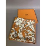 Hermès: a silk carré by Leila Menchari, “Regina”, boxed, hand rolled hem, rust and cream