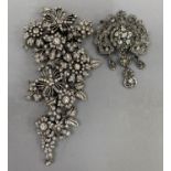 A foliate cluster spray brooch by Sweet Romance, USA, set with colourless foil backed paste,