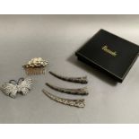 Two large hair ornaments, comprising a clip formed as a butterfly, and a comb with diamanté and