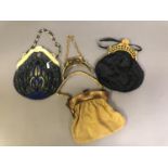 1920’s bags and unused plastic frames: the first, a medium beaded bag with cream bakelite shaped