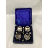 A Victorian four piece silver salt set, each cellar of circular outline, baluster form with ring,