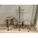 A beech posser together with a small milking stool with rough hewn seat and another taller milking