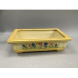 Clarice Cliff 'Sungleam Crocus' rectangular trough planter with flared rim on squat supports,