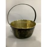 A brass preserve pan with iron hoop handle, 26.5cm diameter