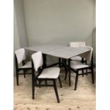 A 1960's Formica drop leaf table with grey grain veneer together with four black framed