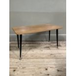 A mid 20th century Formica coffee table on brass and black legs, 75cm wide, 36cm deep, 41cm high