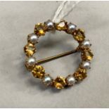 A citrine and pearl wreath brooch, the circular faceted stones and 3mm half pearls claw set in