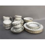 Minton breakfast service of Ermine design with writhen fluted body comprising six dessert plates,