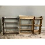 Three pine hanging wall shelves, one with pediment, maximum width 45cm