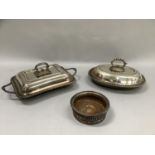 Two silver plated entree dishes and covers of rectangular and oval outline together with a wine
