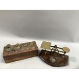 Postal scales on stepped foot together with apothecary weights