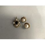 A pair of cultured pearl stud earrings in 9ct gold each set to the centre with a 8.5mm pearl