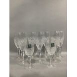 A set of seven Thomas Webb crystal wine glasses and two port glasses, cut bowls and panel stems,