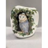 A large vase hand painted with a barn owl amongst ivy to either side, signed Sally Ann Lugg to