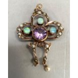 A pendant/brooch collet set with cabochon opals, a circulator facetted amethyst and seed pearls, A/F