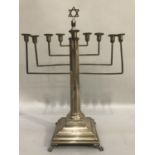 A silver Hanukkah Menorah c.1934 tappered octagonal stem, Star of David finial, stepped square
