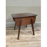 A 1950's teak sewing table with contents, 48cm wide, 47cm high, 38cm deep