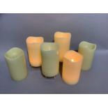 A box containing six large LED faux candles