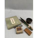 A quantity of calligraphy pens, agate inkwell etc