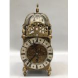 A reproduction brass skeleton clock by Buren, Swiss made, serial number 120989, 25.5cm high