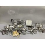A quantity of silver plated cutlery, loose and a set of eight silver plated cake forks in fitted