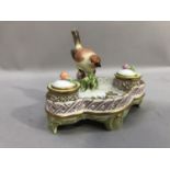 Herend porcelain inkstand on four feet with a central model of a bird on a branch, the wells with