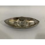 An Edward VII cut glass inkwell with silver top on a silver stand of pierced marquise outline on