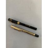 A 'Royal' vintage black cased fountain pen and a vintage rolled gold cased fountain pen both with
