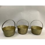 Three brass preserve pans with iron hoop handles