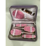 An Edward VIII silver and pink guilloche enamel six piece dressing table set, consisting of two hair