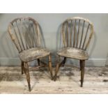 A pair of beech and elm spindle back kitchen chairs