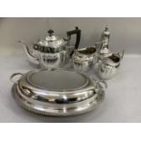 A silver plated three piece tea service, a sugar caster and an entree dish and cover with gadroon