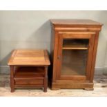 An audio cabinet and matching lamp table with double sided drawers