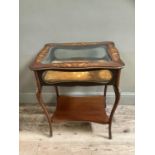 A Continental bijouterie table with glazed lift up lid, the interior fabric lined, brass beading,