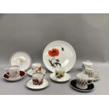 A Susie Cooper coffee can and saucer of uncommon sponge decoration in brown and black on white,