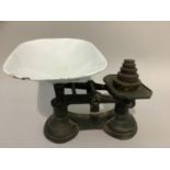 A set of weighing scales with weights