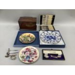 A mahogany tea caddy, a cased set of fish knives and forks, three china plates limited editions,