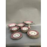 19th century dessert service, bordered in pink and centered with a garland of printed and