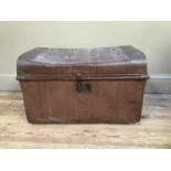 A metal trunk with twin end handles in, studded to the lid with lock to the front and twin bar