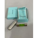 A pen knife signed Tiffany & Co and Victorinox with silver faced grip with five blades and
