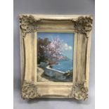 Continental coastal landscape with terrace and blossom tree, oil on canvas, indistinctly signed to