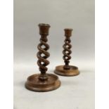 A pair of Victorian fruit wood open twist candlesticks on dished bases, 17cm high