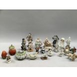A collection of mainly Continental china figures, one as a box and cover, strawberry, salt and