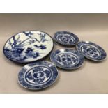 A large late 19th century Chinese charger with prunus and pheasant together with four oval dishes