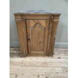 A pine hanging corner cupboard, 19th century, with colonnade supports, three internal shelves, no