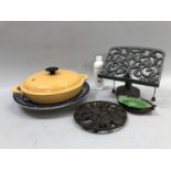 A Le Creuset butterscotch twin handled lidded pan together with Arabic painted charger, cast