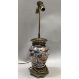 A gilt metal mounted Imari vase shaped table lamps, the ovoid body painted in underglaze blue ,