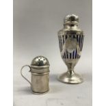 A Victorian silver pepper pot, pierced urn form, open cartouche over a circular foot and blue