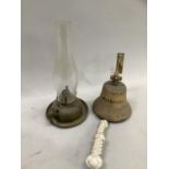 A brass portable oil lamp stamped with V to the underneath, together with a wall mounted brass